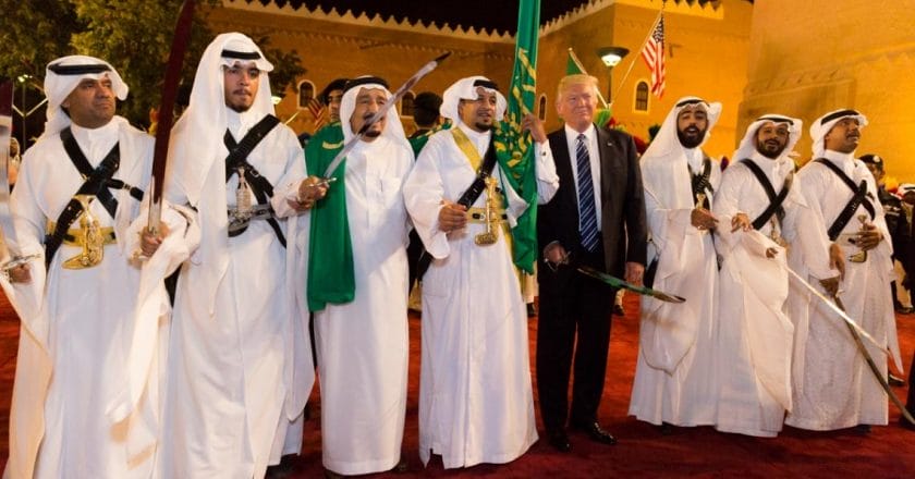 Donald_Trump_with_ceremonial_swordsmen_on_his_arrival_to_Murabba_Palace,_May_2017