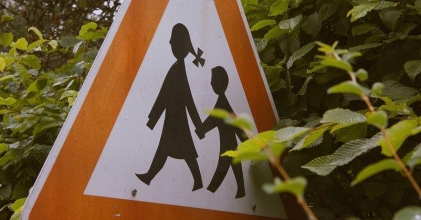 road-sign-with-children-in-trees