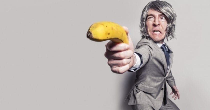 businessman-aiming-with-banana